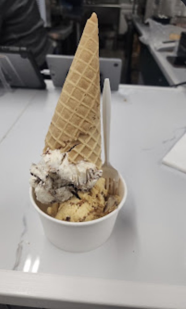 Kawartha ice cream in a cup topped with a waffle cone